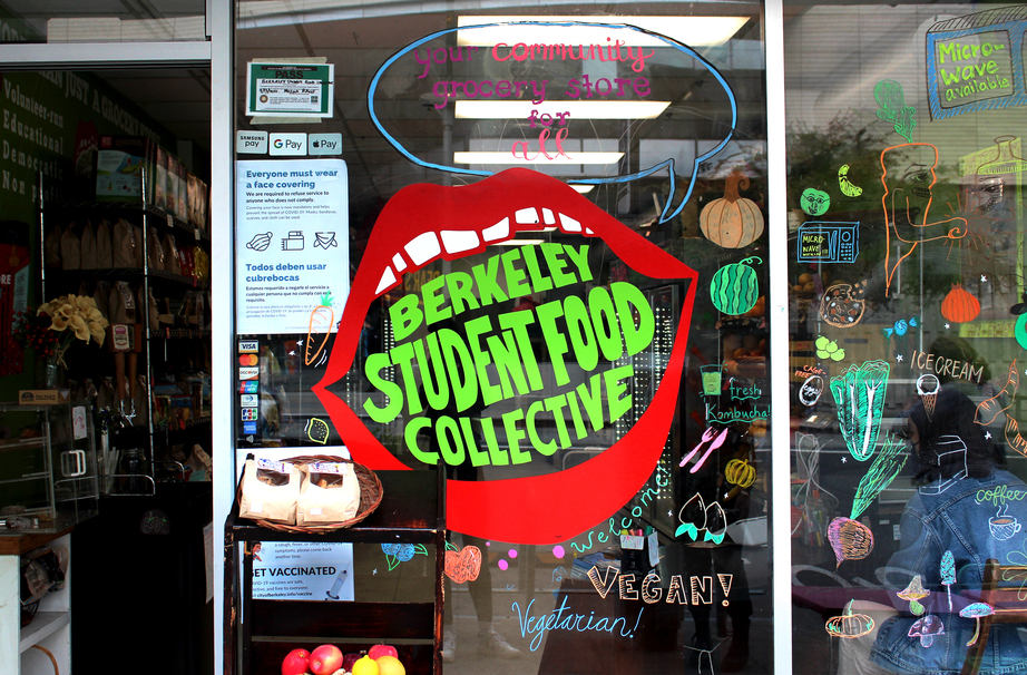 Picture of a storefront with a large mouth logo with "Berkeley Student Food Collective" inside the mouth